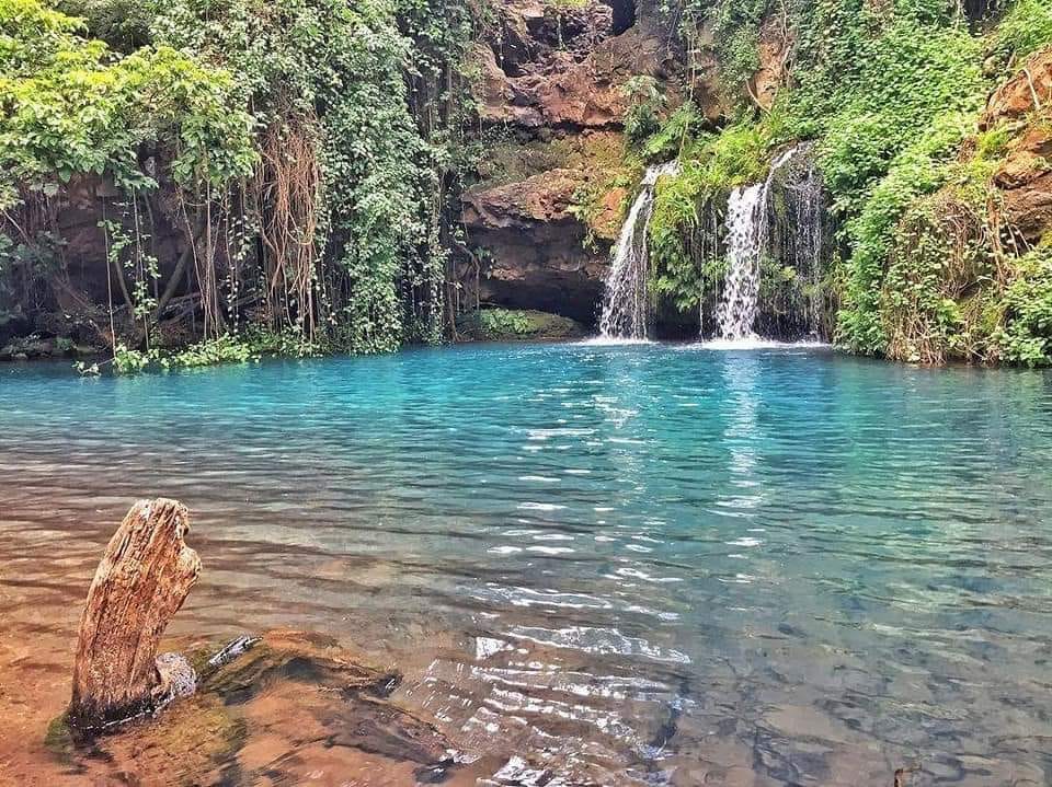 A blue pool and waterfall in Ngare Ndare